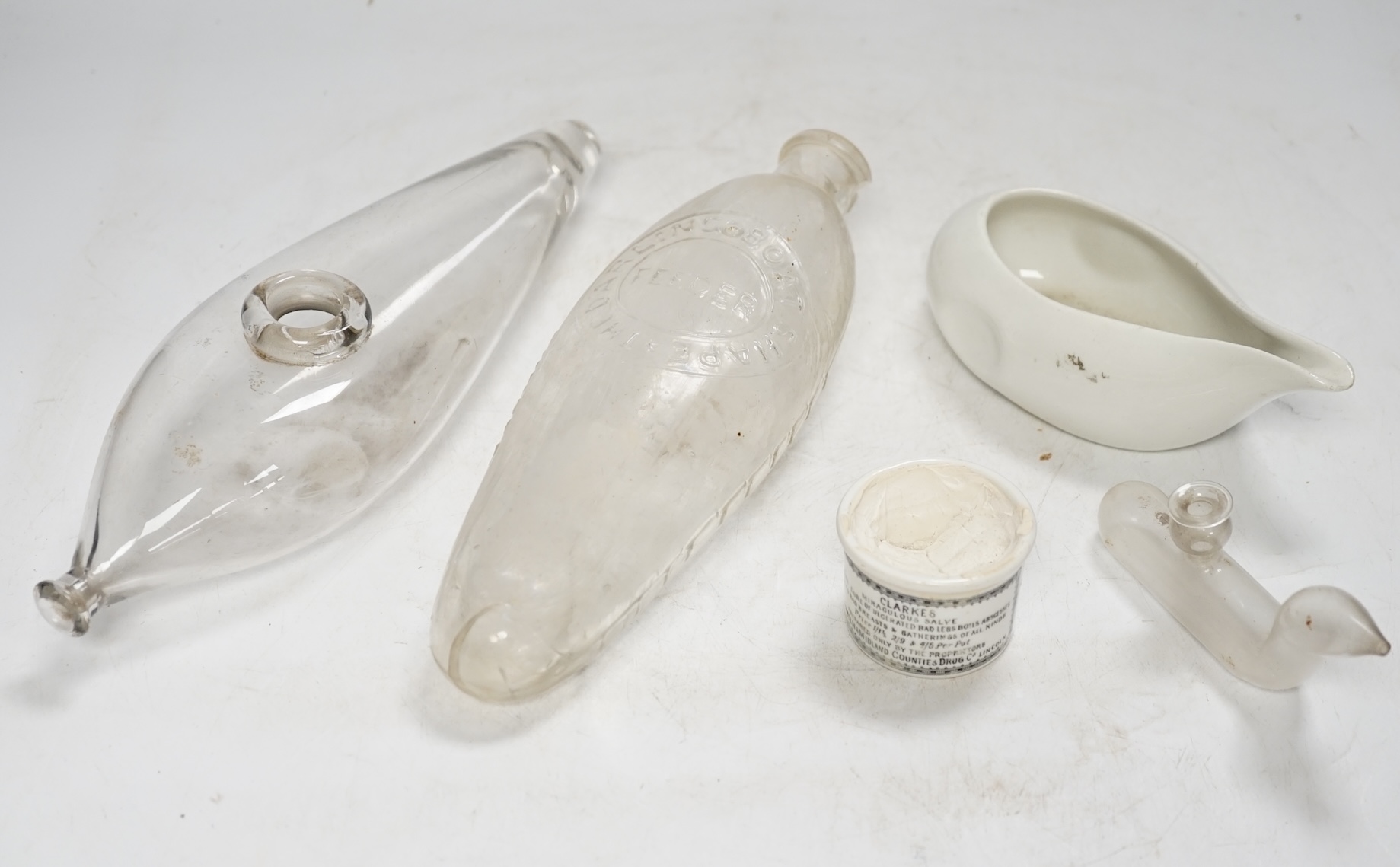 A collection of ceramic ointment jars, glass bottles and pap boats, etc. Condition varies